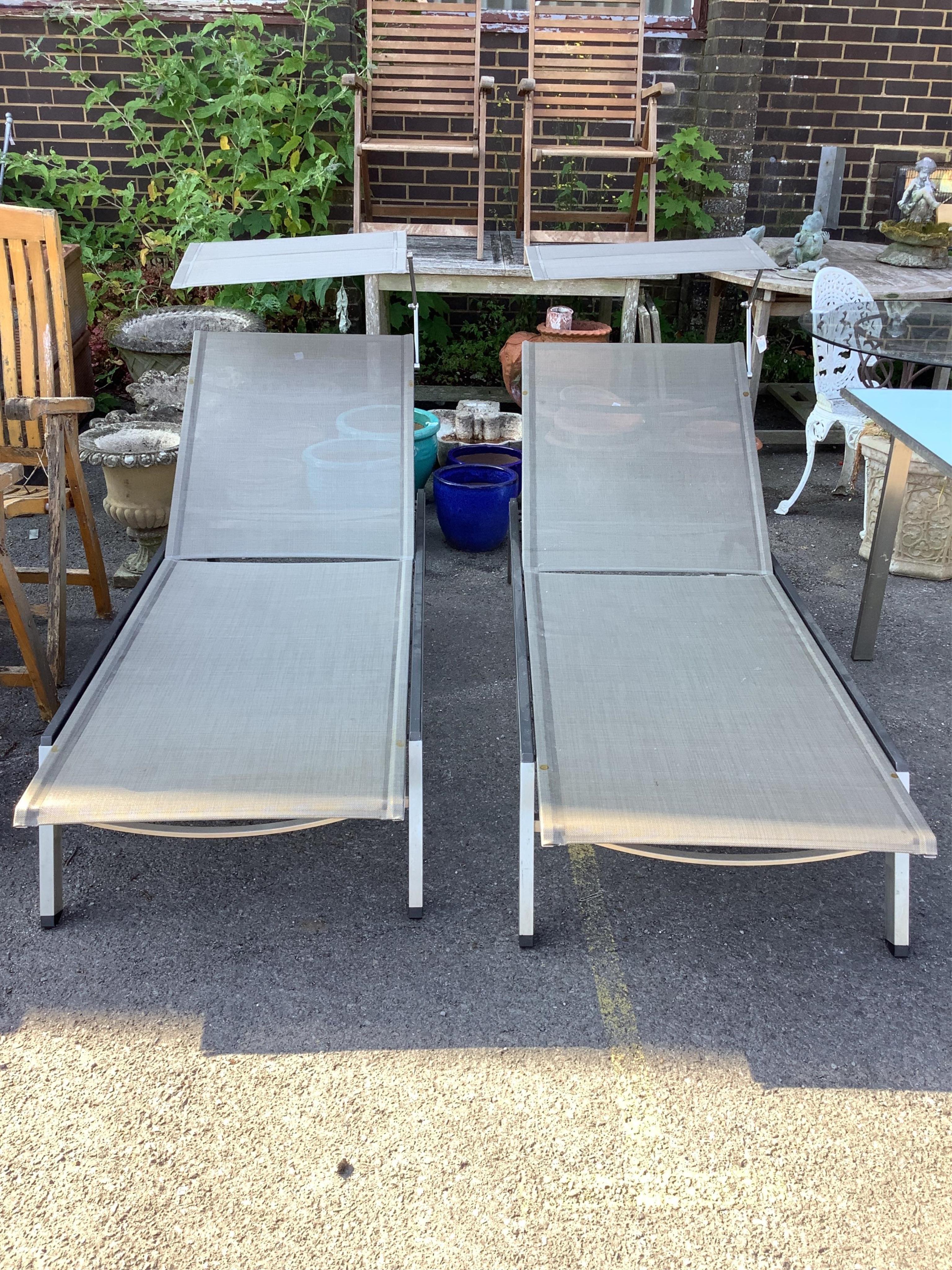 A pair of Barlow Tyrie Equinox stainless steel (marine grade) garden loungers with sun shades. Condition - fair